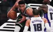 Booker's Buzzer-Beater Lifts Suns, Giannis Dominates in NBA Action