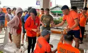 Coast Guard Auxiliary Serves Meals to 5,835 Stranded Passengers Amid Basyang
