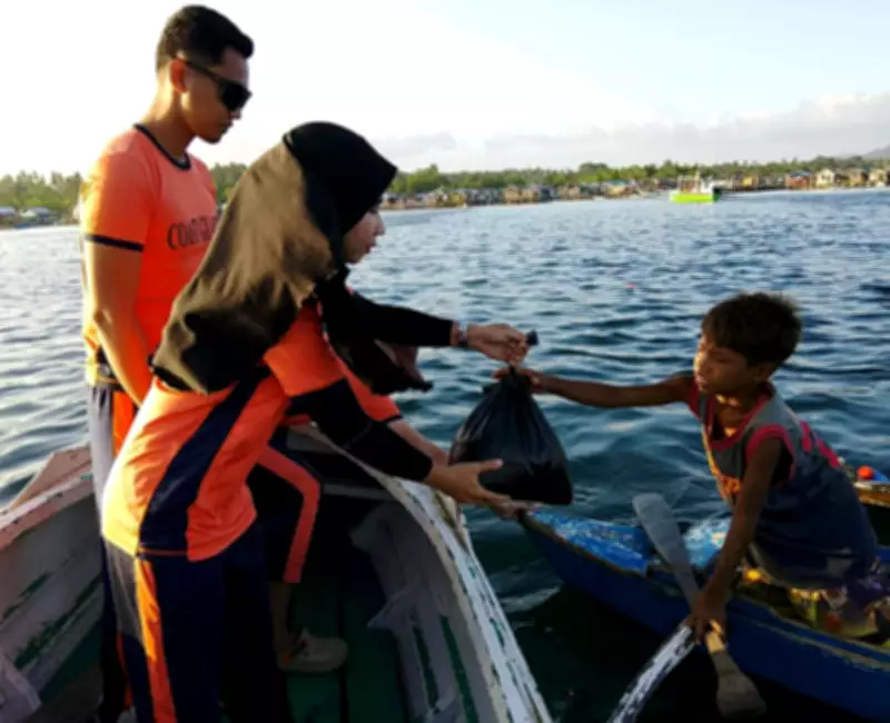 Philippine Coast Guard Delivers Aid to Sulu Fishermen During Maritime Patrol